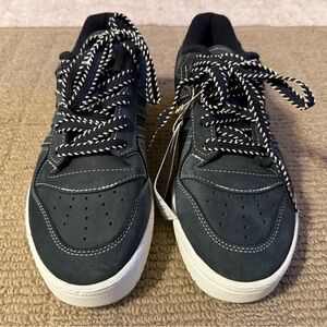 This is an Adidas Rivalry Low Core Black / Cloud White sneaker